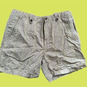 Woman's gray plaid shorts with small neon green detail